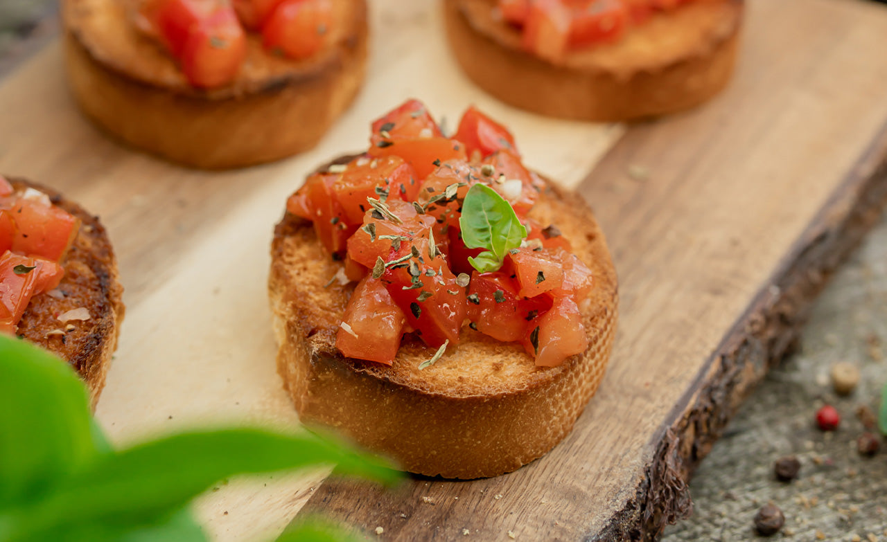 Classic bruschetta with basil leaf