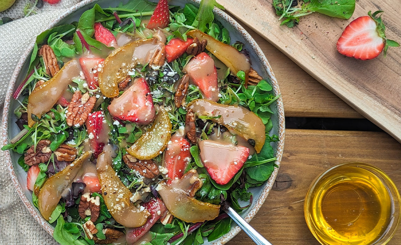 Delicious strawberry and pear salad with balsamic dressing